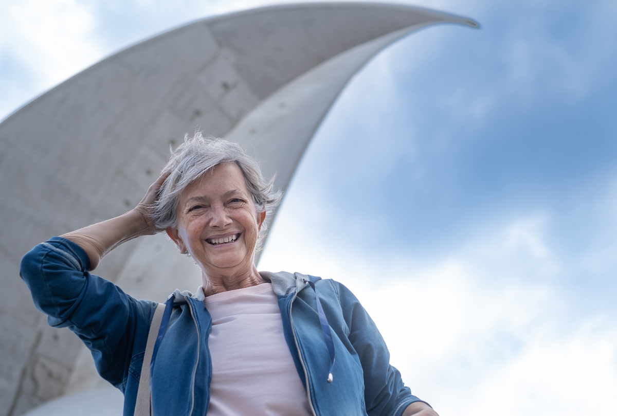 Senior woman smiling confidently after cosmetic dental care